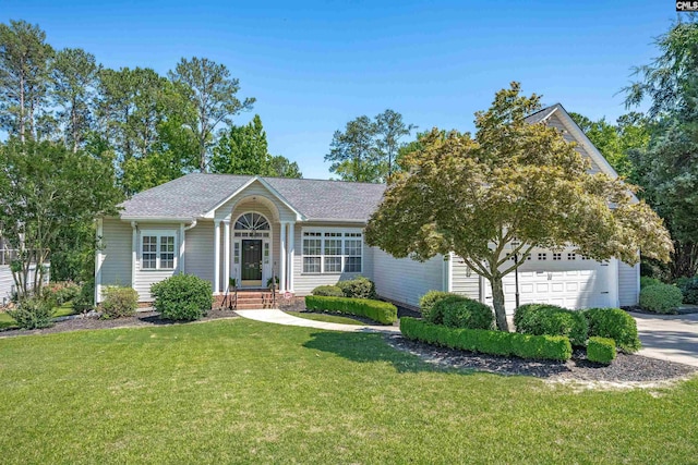 175 Stoney Pointe Dr, Chapin, SC 29036 - ranch-style house with a front yard, an attached garage, driveway, and roof with shingles