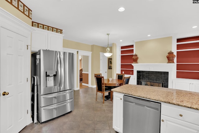175 Stoney Pointe Dr, Chapin, SC 29036 - kitchen featuring appliances with stainless steel finishes, white cabinets, light tile patterned flooring, recessed lighting, and pendant lighting