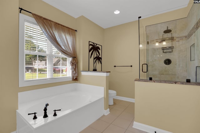 175 Stoney Pointe Dr, Chapin, SC 29036 - bathroom featuring tile patterned floors, a stall shower, toilet, a garden tub, and baseboards
