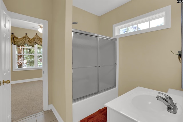 175 Stoney Pointe Dr, Chapin, SC 29036 - bathroom with a sink, combined bath / shower with glass door, baseboards, and tile patterned floors