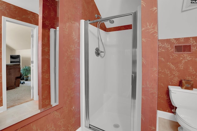 175 Stoney Pointe Dr, Chapin, SC 29036 - full bathroom featuring wallpapered walls, toilet, a stall shower, and baseboards
