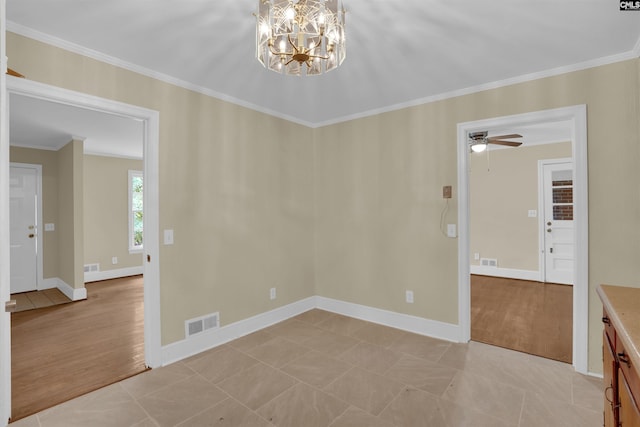 1669 Upland Dr, Columbia, SC 29204 - spare room featuring crown molding, a chandelier, a ceiling fan, and baseboards