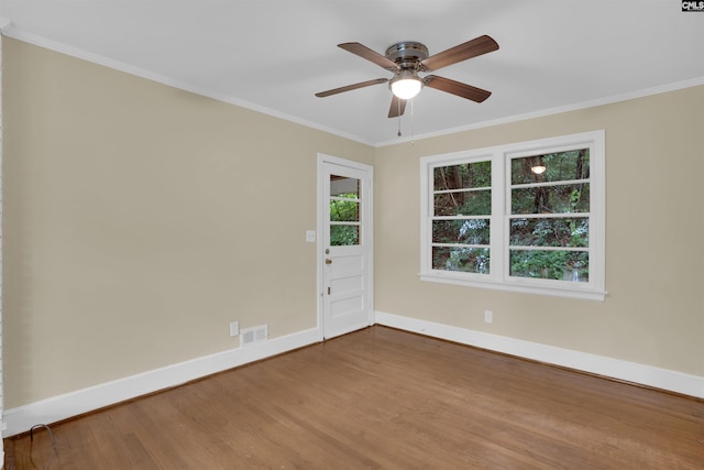 1669 Upland Dr, Columbia, SC 29204 - spare room with baseboards, wood finished floors, ceiling fan, and crown molding