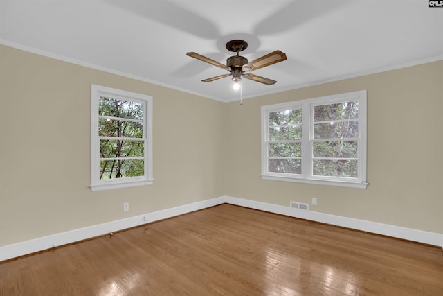 1669 Upland Dr, Columbia, SC 29204 - empty room featuring baseboards, wood finished floors, crown molding, and a ceiling fan