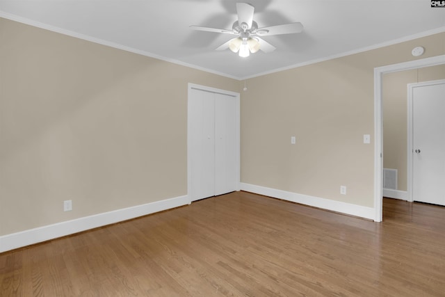 1669 Upland Dr, Columbia, SC 29204 - spare room featuring wood finished floors, ceiling fan, baseboards, crown molding, and a smoke detector