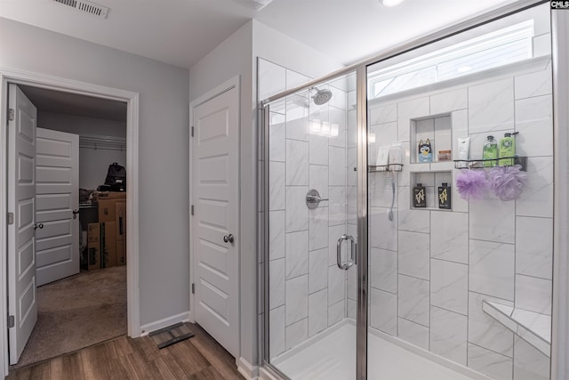 1051 Ashcroft Cir, Columbia, SC 29229 - full bath with wood finished floors, a stall shower, and baseboards