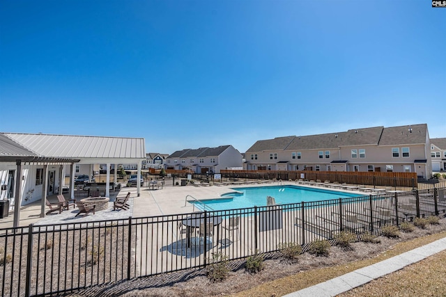 1051 Ashcroft Cir, Columbia, SC 29229 - community pool featuring an outdoor fire pit, a patio area, a residential view, and a pergola