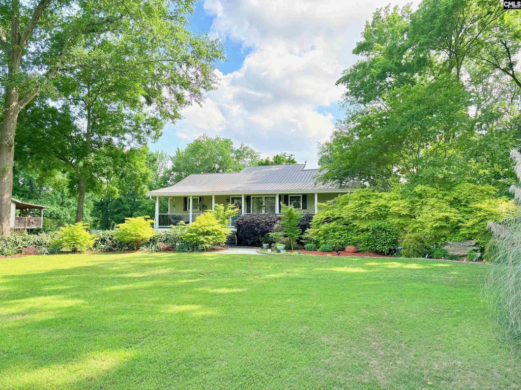191 Wild Turkey Ln, Camden, SC 29020 - view of front of house with a front yard and metal roof