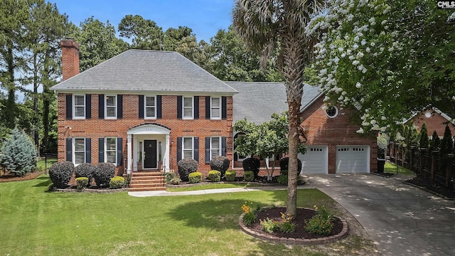 105 Hamptons Grant Ct, Columbia, SC 29209 - colonial inspired home featuring a chimney, concrete driveway, brick siding, and a garage