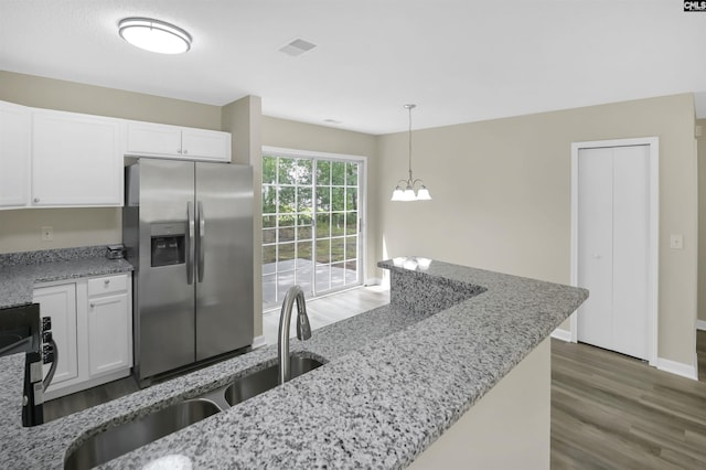 414 Fountain Lk, Columbia, SC 29209 - kitchen featuring stainless steel fridge, wood finished floors, white cabinetry, and light stone countertops