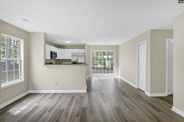 414 Fountain Lk, Columbia, SC 29209 - unfurnished living room featuring dark wood-style flooring and baseboards