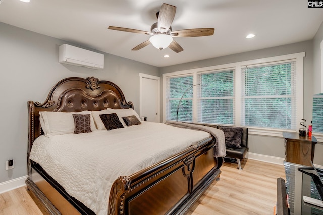 3308 Keenan Dr, Columbia, SC 29201 - bedroom featuring an AC wall unit, baseboards, light wood finished floors, ceiling fan, and recessed lighting