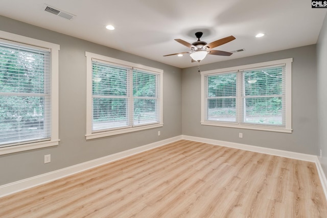 3308 Keenan Dr, Columbia, SC 29201 - empty room with healthy amount of natural light, wood finished floors, ceiling fan, recessed lighting, and baseboards
