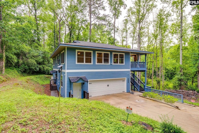 3308 Keenan Dr, Columbia, SC 29201 - view of front facade featuring stairway, driveway, and an attached garage