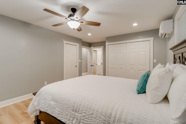 3308 Keenan Dr, Columbia, SC 29201 - bedroom with a wall mounted air conditioner, light wood-type flooring, recessed lighting, baseboards, and a ceiling fan