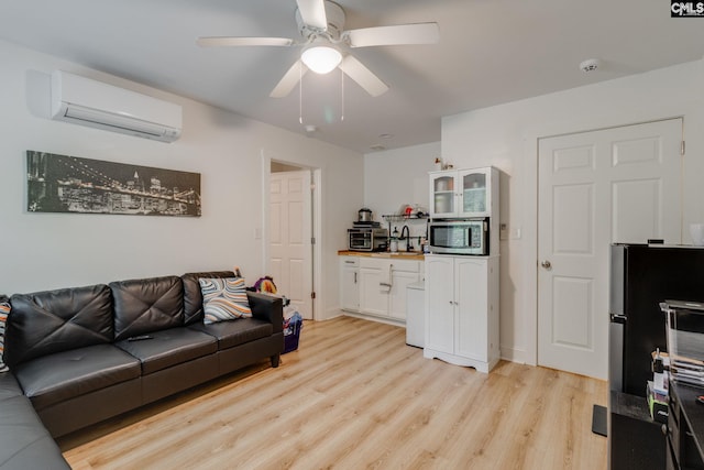 3308 Keenan Dr, Columbia, SC 29201 - living room featuring a wall mounted air conditioner, light wood finished floors, and a ceiling fan
