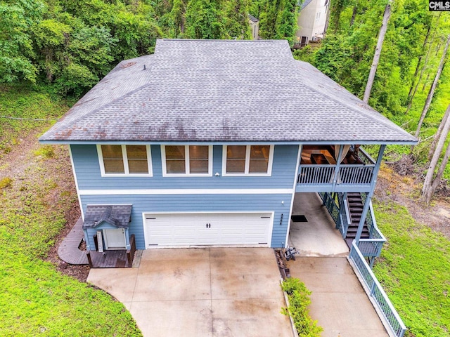 3308 Keenan Dr, Columbia, SC 29201 - view of front of home featuring stairs, a shingled roof, a garage, and driveway