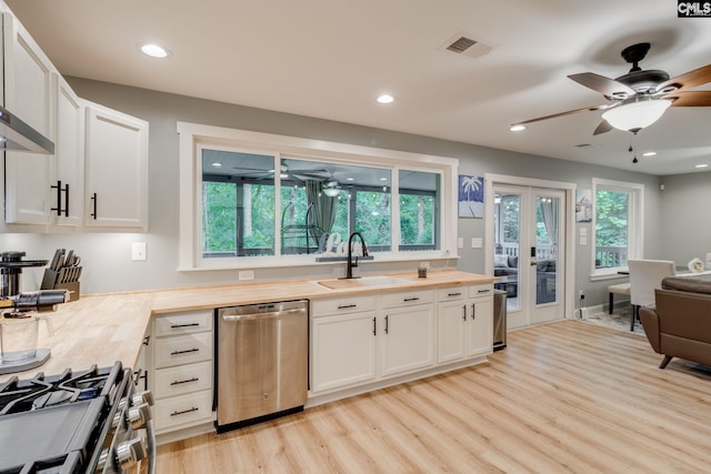 3308 Keenan Dr, Columbia, SC 29201 - kitchen with stainless steel appliances, a sink, light wood finished floors, a ceiling fan, and butcher block countertops