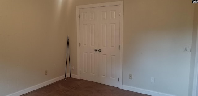 1801 Tall Pines Cir, Columbia, SC 29205 - unfurnished bedroom featuring dark colored carpet, a closet, and baseboards
