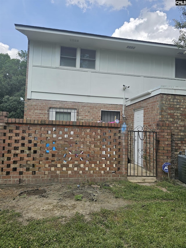 1801 Tall Pines Cir, Columbia, SC 29205 - view of side of home featuring board and batten siding, brick siding, and central air condition unit