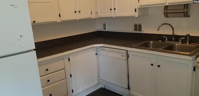 1801 Tall Pines Cir, Columbia, SC 29205 - kitchen featuring white appliances, a sink, white cabinetry, and dark countertops