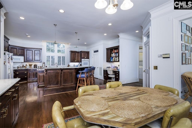 7021 Cleaton Rd, Columbia, SC 29206 - dining room featuring dark wood-type flooring, recessed lighting, a chandelier, and ornamental molding