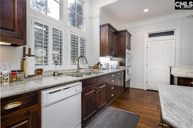 7021 Cleaton Rd, Columbia, SC 29206 - kitchen with white appliances, a sink, plenty of natural light, dark brown cabinetry, and ornamental molding