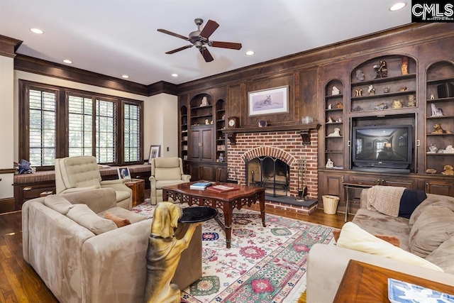 7021 Cleaton Rd, Columbia, SC 29206 - living area with ornamental molding, a ceiling fan, a fireplace, wood finished floors, and recessed lighting