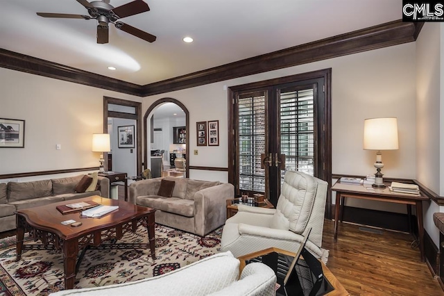 7021 Cleaton Rd, Columbia, SC 29206 - living room with ornamental molding, ceiling fan, arched walkways, french doors, and wood finished floors