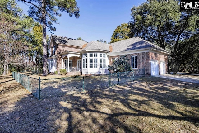 7021 Cleaton Rd, Columbia, SC 29206 - view of front of house with an attached garage, brick siding, and driveway