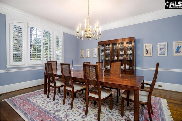 7021 Cleaton Rd, Columbia, SC 29206 - dining room with a chandelier, crown molding, wood finished floors, and baseboards