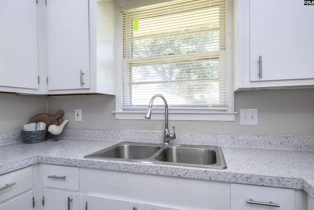 2667 Ford St, Sumter, SC 29154 - kitchen with a sink, light countertops, and white cabinets