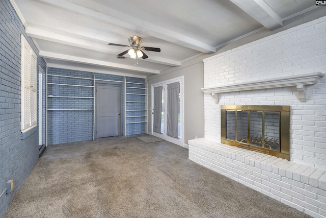 2667 Ford St, Sumter, SC 29154 - unfurnished living room with beam ceiling, brick wall, carpet floors, a ceiling fan, and a brick fireplace