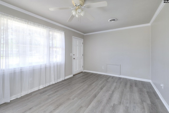 2667 Ford St, Sumter, SC 29154 - spare room with wood finished floors, ornamental molding, ceiling fan, and baseboards