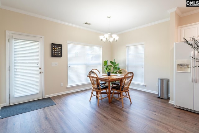 209 Windsor Trace Dr, Columbia, SC 29209 - dining space featuring ornamental molding, a chandelier, dark wood-type flooring, and baseboards