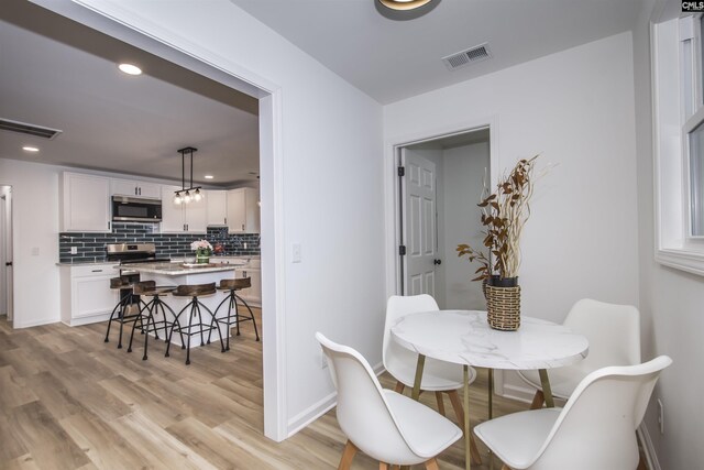 108 Bickleigh Rd, Irmo, SC 29063 - dining area featuring light wood-type flooring, recessed lighting, and baseboards