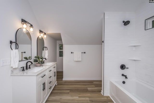 108 Bickleigh Rd, Irmo, SC 29063 - bathroom featuring wood finished floors, double vanity,  shower combination, lofted ceiling, and baseboards