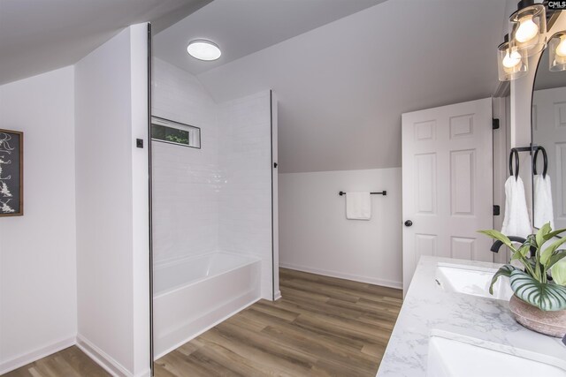 108 Bickleigh Rd, Irmo, SC 29063 - bathroom with vaulted ceiling, wood finished floors, double vanity, washtub / shower combination, and baseboards