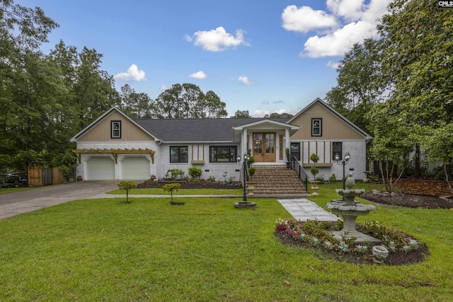 225 Park Shore Dr, Columbia, SC 29223 - view of front facade featuring french doors, a front lawn, driveway, and an attached garage