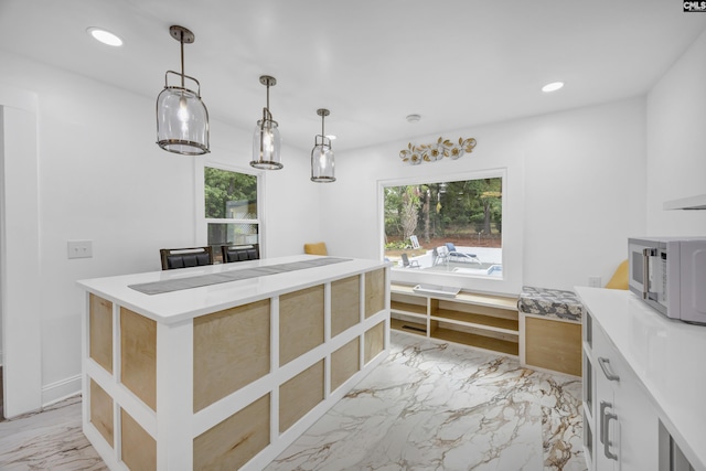 225 Park Shore Dr, Columbia, SC 29223 - kitchen with white microwave, light marble finish floors, recessed lighting, light countertops, and hanging light fixtures