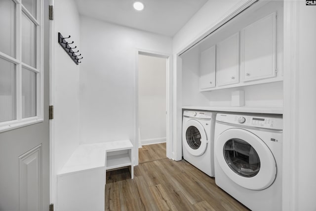 225 Park Shore Dr, Columbia, SC 29223 - laundry area with independent washer and dryer, cabinet space, light wood finished floors, and recessed lighting