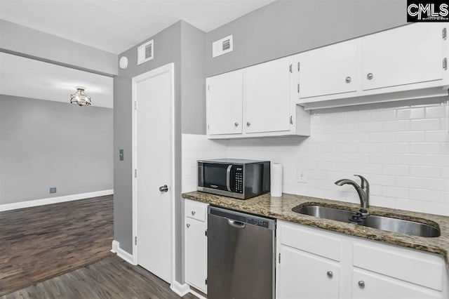 619 King St Unit 608, Columbia, SC 29205 - kitchen with dishwasher, a sink, dark wood finished floors, and dark stone counters
