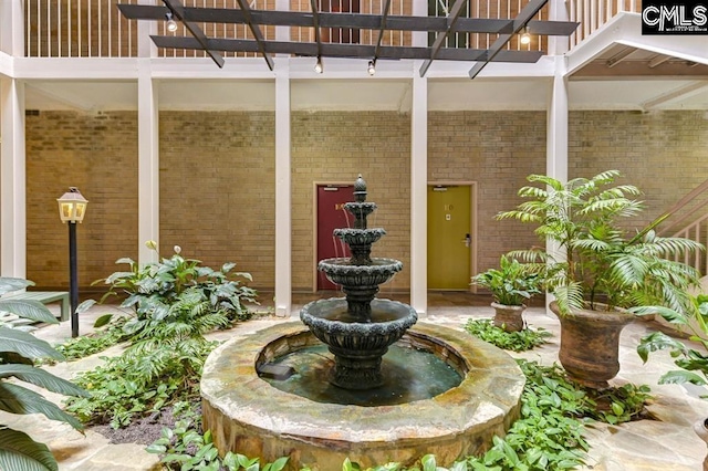 619 King St Unit 608, Columbia, SC 29205 - entrance to property featuring brick siding and a pergola
