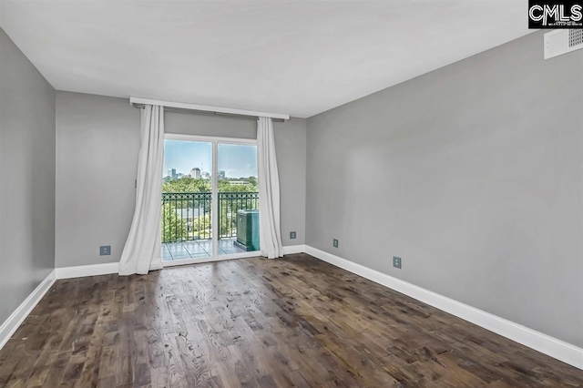 619 King St Unit 608, Columbia, SC 29205 - empty room featuring dark wood-style flooring and baseboards