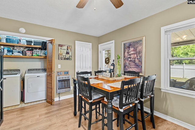 319 Graham St, West Columbia, SC 29169 - dining area featuring heating unit, washer and clothes dryer, light wood finished floors, baseboards, and a ceiling fan