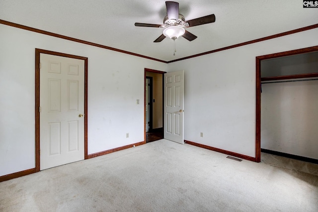 589 White Pines Cir, Camden, SC 29020 - unfurnished bedroom featuring carpet, baseboards, a closet, ceiling fan, and ornamental molding