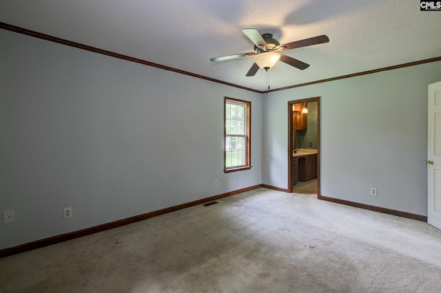 589 White Pines Cir, Camden, SC 29020 - empty room with light colored carpet, a ceiling fan, ornamental molding, baseboards, and a textured ceiling