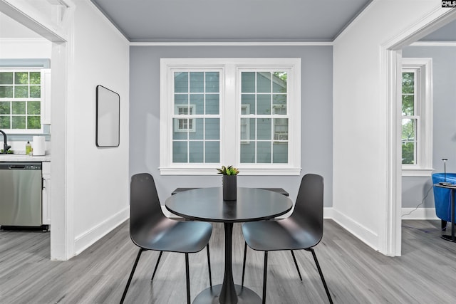 618 Joan St, Columbia, SC 29203 - dining area with light wood-style flooring, baseboards, plenty of natural light, and ornamental molding