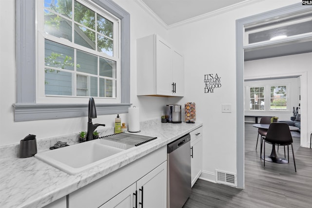 618 Joan St, Columbia, SC 29203 - kitchen with dishwasher, a sink, dark wood-style flooring, crown molding, and white cabinets