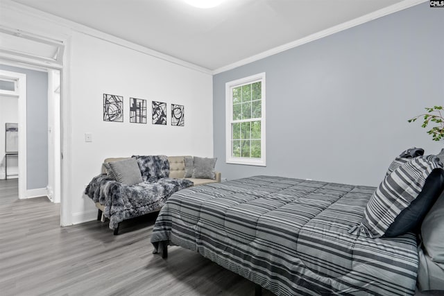 618 Joan St, Columbia, SC 29203 - bedroom featuring wood finished floors, crown molding, and baseboards